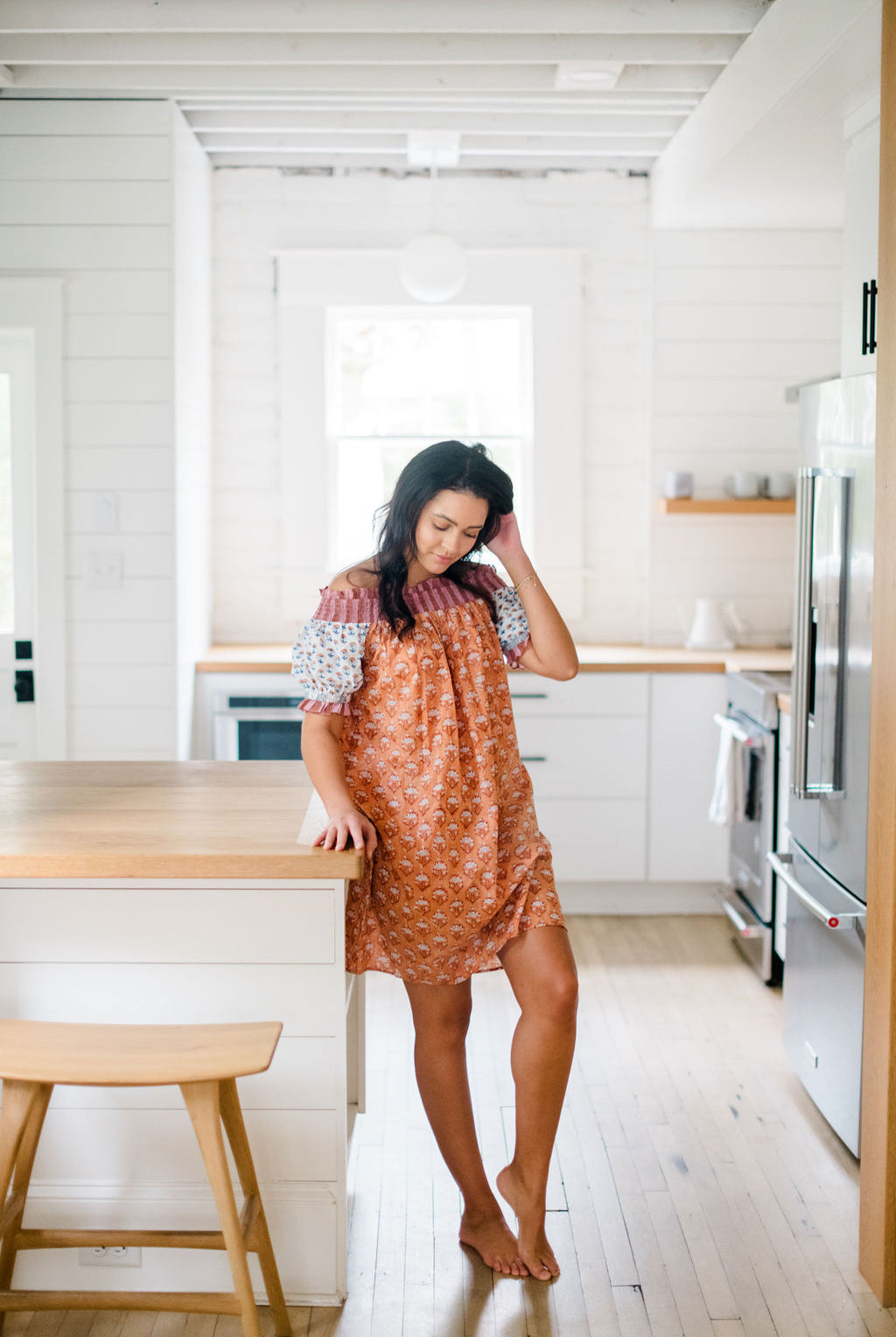 Woman wearing the Graycee Nightgown by Sundara in the kitchen – soft, flowy cotton sleepwear with hand-block prints, designed for relaxed mornings at home
