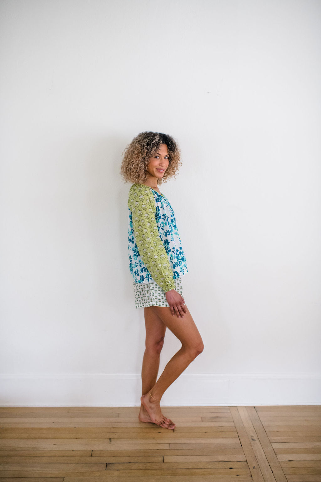 Woman wearing the Ryan sleep top and the Avery sleep short, featuring an airy silhouette and delicate hand-printed detail for effortless comfort