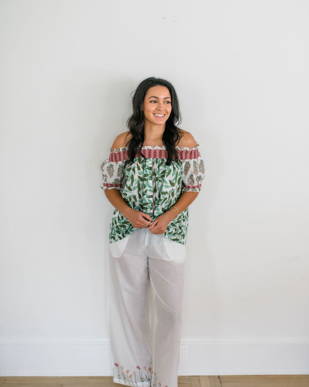 Woman wearing the Winnie Top and Logan Pant by Sundara – a cozy cotton pajama set with hand-block printed details, designed for relaxed, everyday comfort
