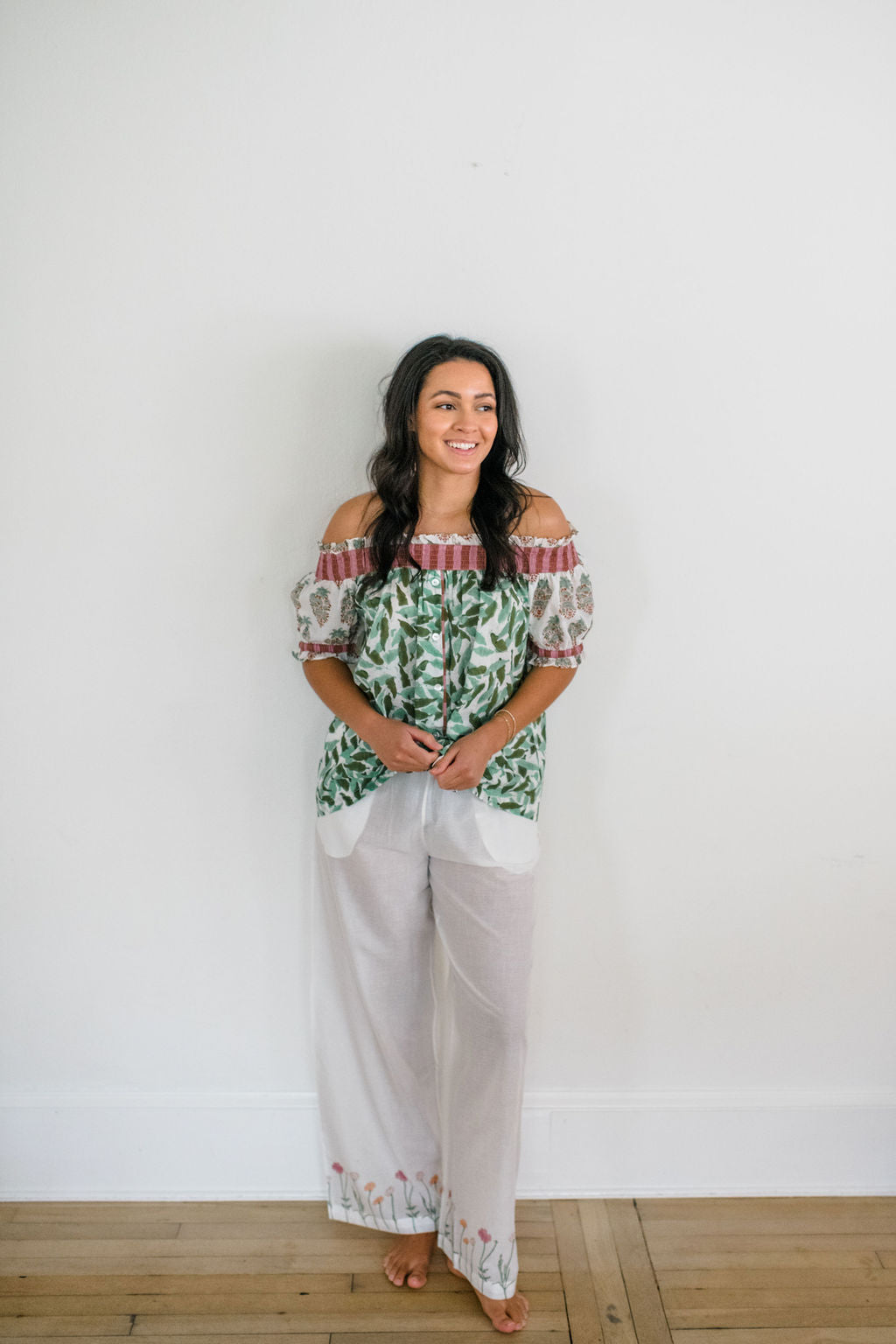 Woman wearing the Winnie Top and Logan Pant by Sundara – a cozy cotton pajama set with hand-block printed details, designed for relaxed, everyday comfort