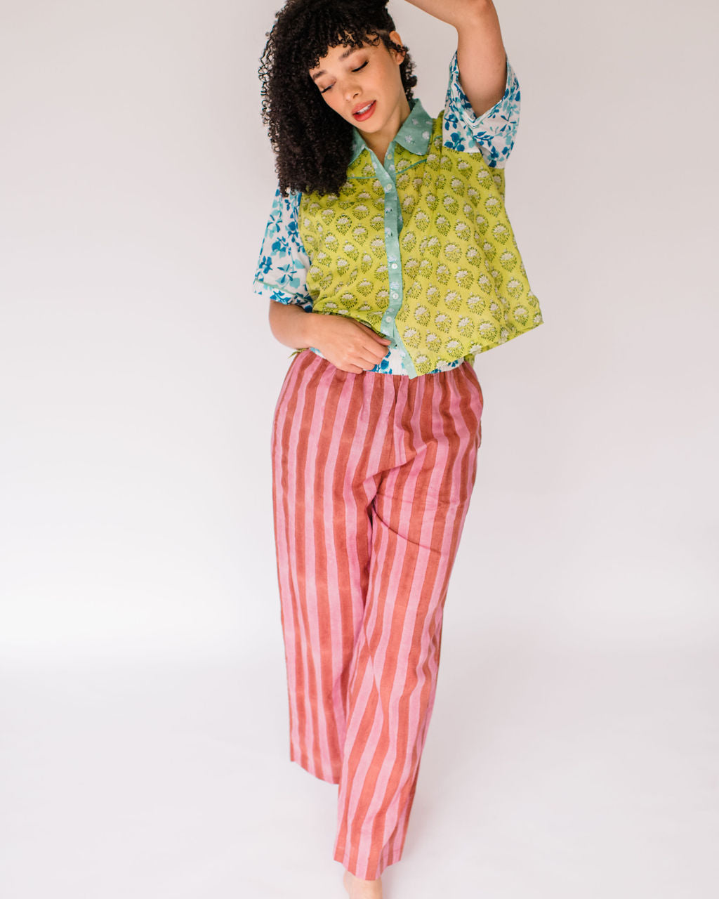 Woman wearing the Dorothy Top and Logan Pant by Sundara – a comfortable cotton pajama set featuring hand-block prints and a relaxed silhouette for everyday ease