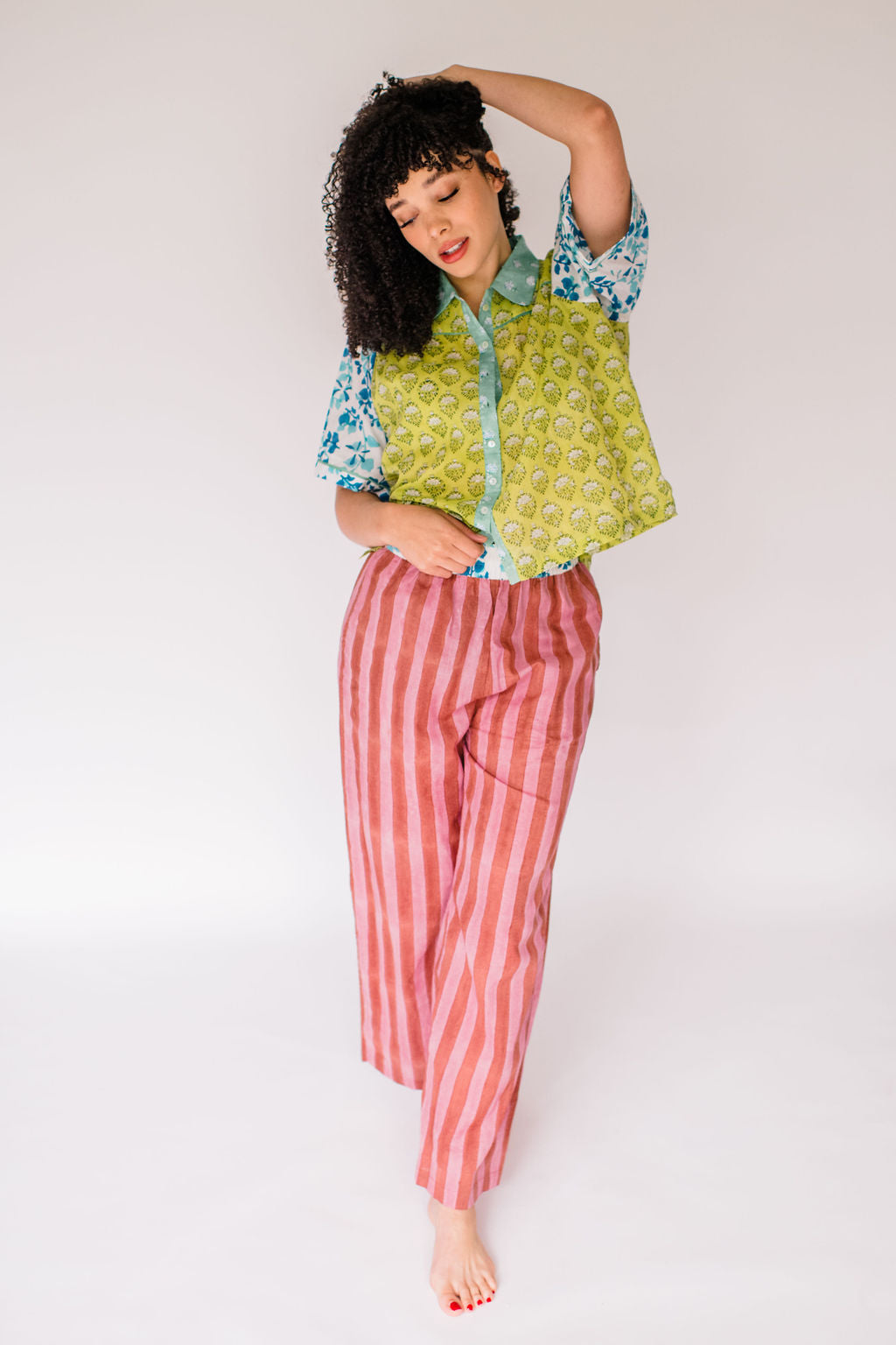 Woman wearing the Dorothy Top and Logan Pant by Sundara – a comfortable cotton pajama set featuring hand-block prints and a relaxed silhouette for everyday ease