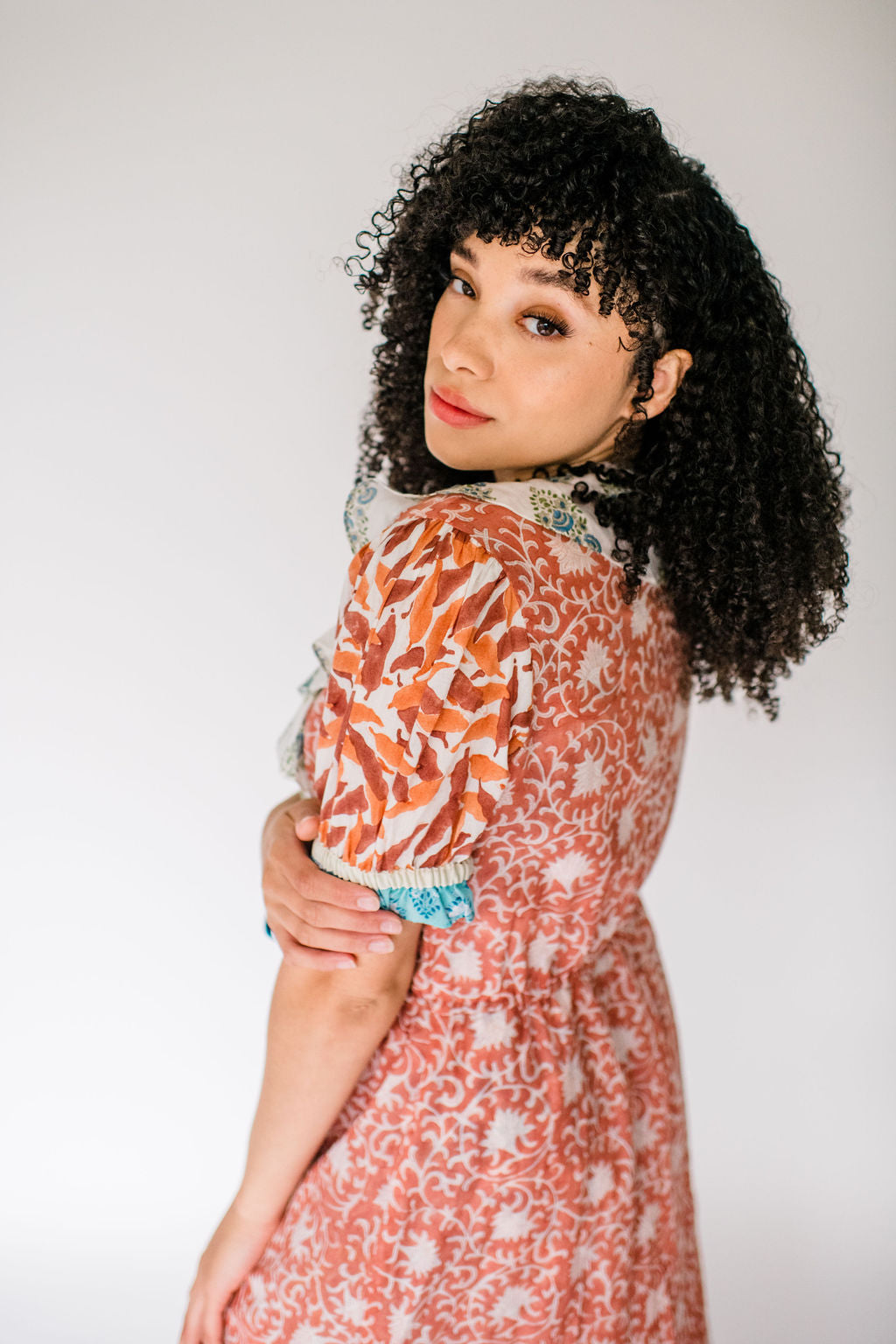 Woman wearing Jeanne Robe by SUNDARA – lightweight block printed cotton robe in artisanal floral print
