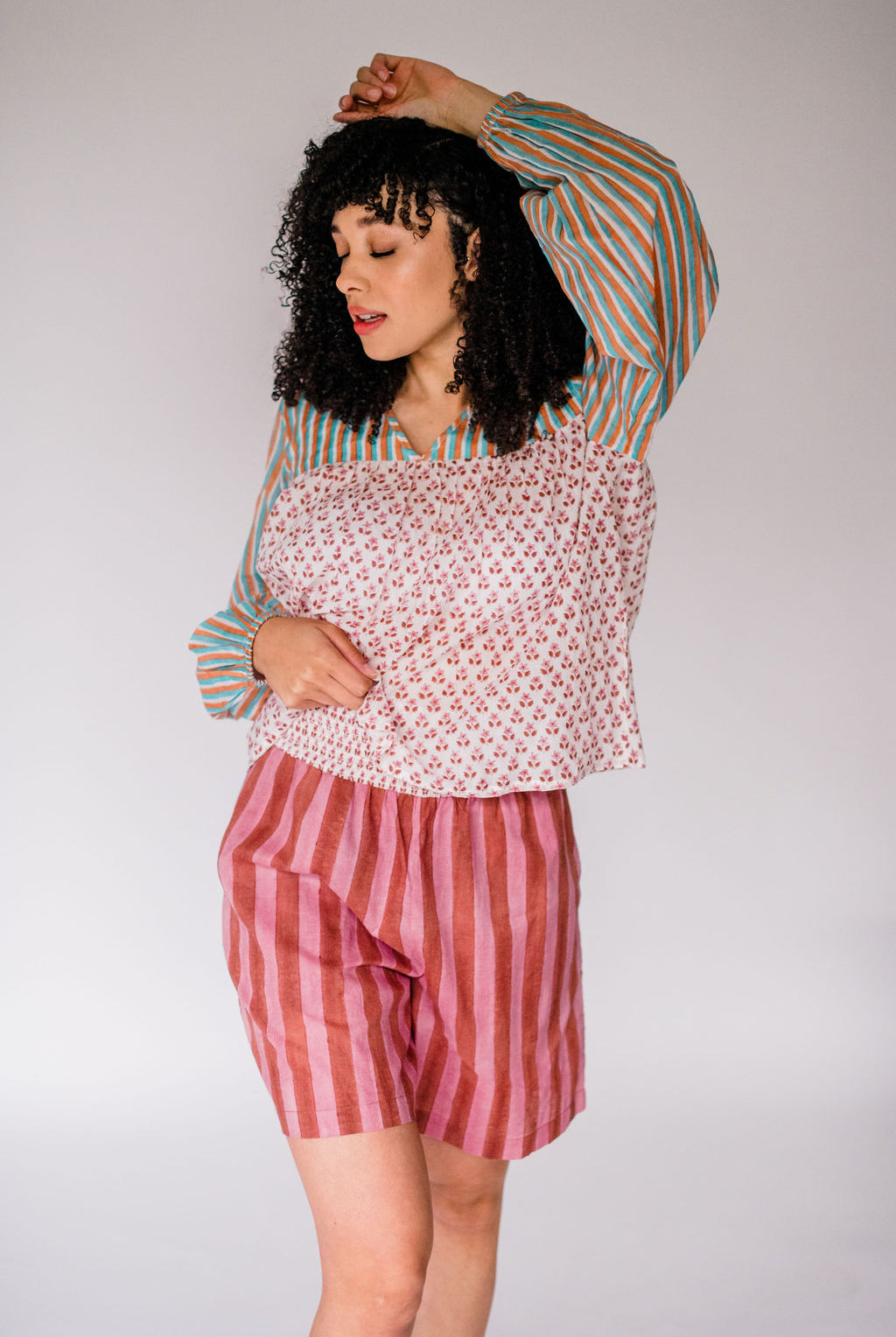 Woman wearing the Ryan Top and Jae Short by Sundara – a relaxed cotton sleep set with hand-block prints, perfect for warm nights and easy mornings
