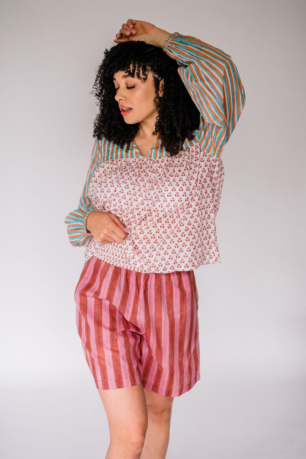 Woman wearing the Ryan Top and Jae Short by Sundara – a relaxed cotton sleep set with hand-block prints, perfect for warm nights and easy mornings