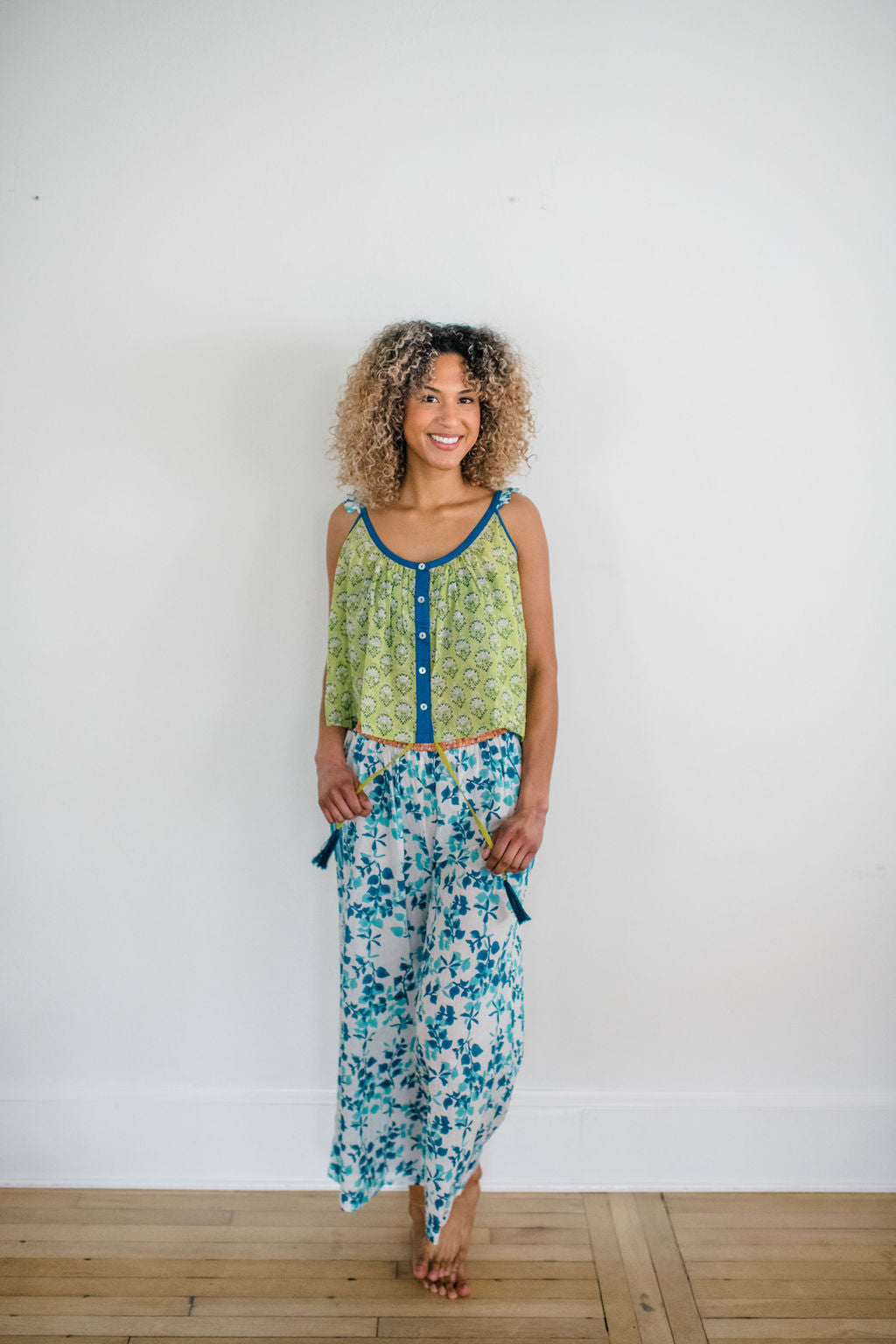 Woman wearing the Livi Pant and Madi Top by Sundara – a stylish cotton sleep set with hand-block prints, designed for ultimate comfort and casual elegance.
