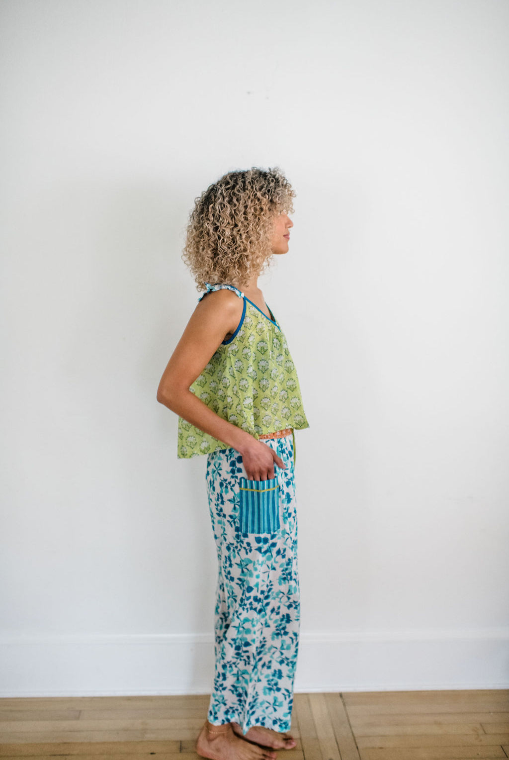 Woman wearing the Madi Top and Livi Pants by Sundara – a cozy, hand-block printed cotton loungewear set, offering effortless style and comfort for relaxed moments