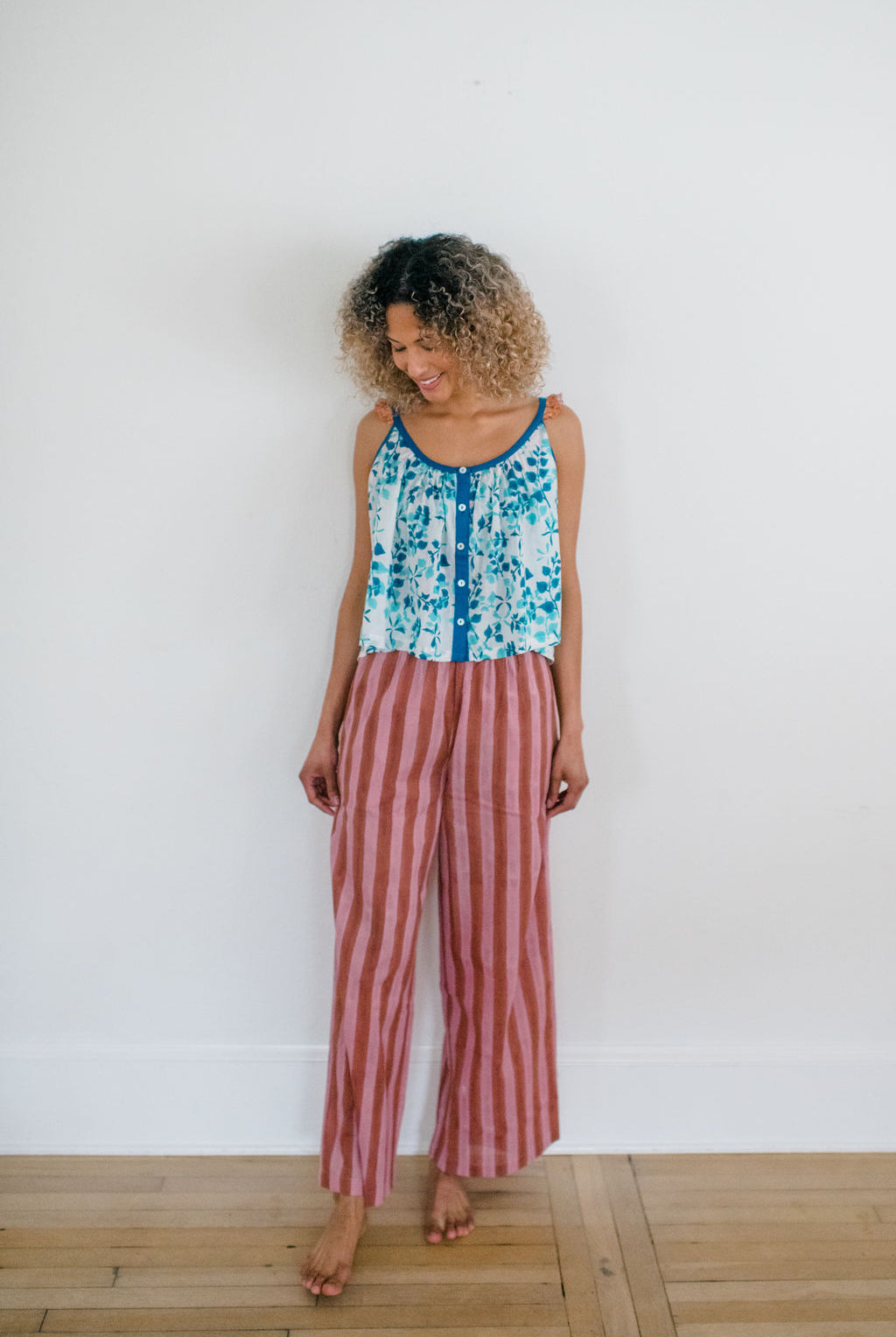 Woman wearing the Logan Pant and Madi Top by Sundara – a stylish cotton sleep set with hand-block prints, designed for ultimate comfort and casual elegance.