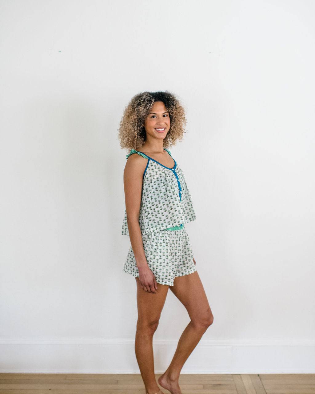 Woman in the Madi Top and Avery Shorts by Sundara – soft, hand-block printed cotton loungewear for ultimate comfort and laid-back style