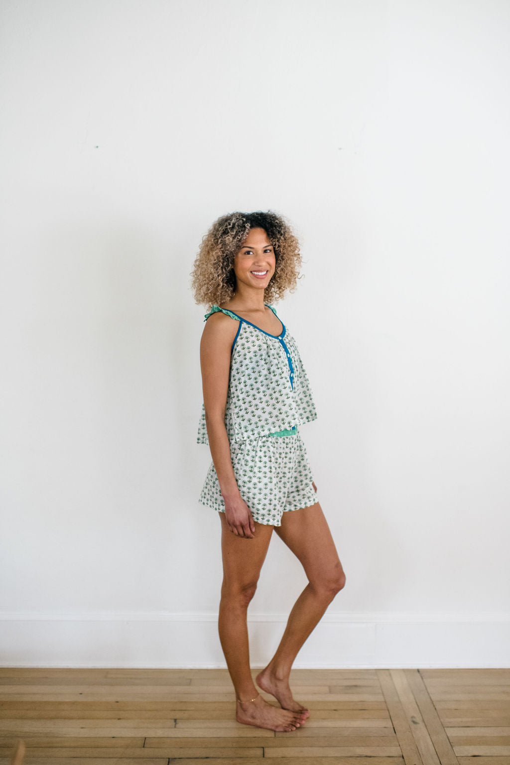 Woman in the Madi Top and Avery Shorts by Sundara – soft, hand-block printed cotton loungewear for ultimate comfort and laid-back style