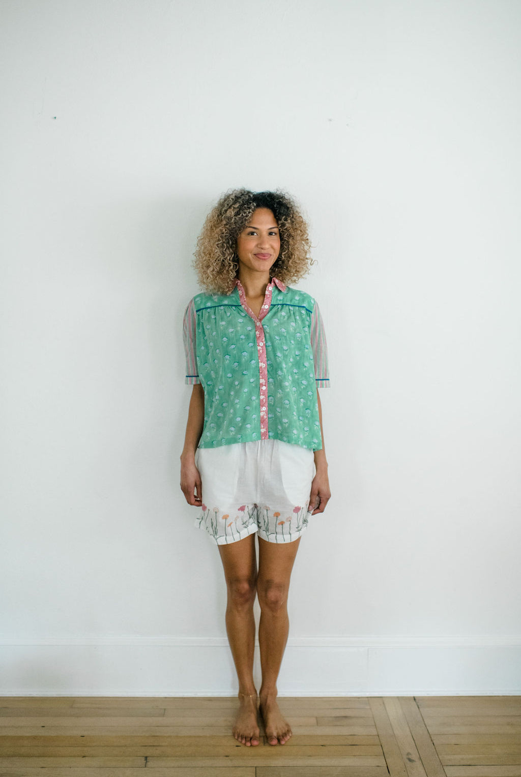 Woman wearing the Dorothy Top and Jae Short by Sundara – comfortable cotton sleepwear with hand-block prints, offering relaxed style and effortless comfort.”