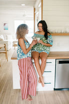 Two Woman having coffee in the kitchen wearing  the Sundara pajama sets – soft cotton sleepwear with hand-block prints, blending comfort and casual elegance.