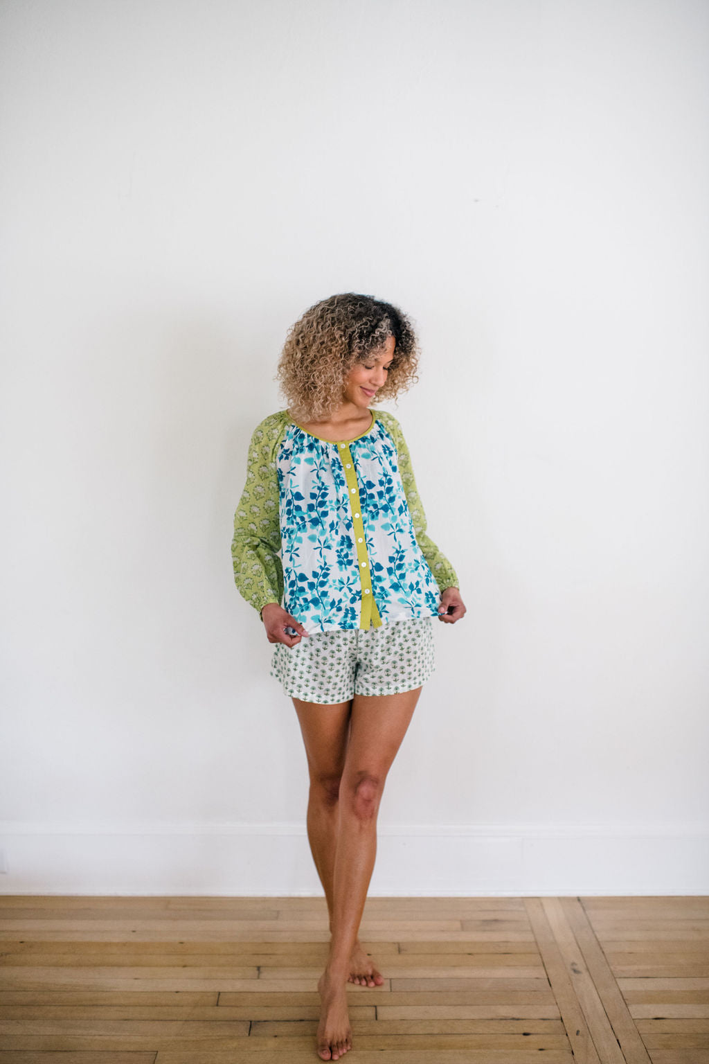 Woman wearing the Ryan top and the Avery sleep short featuring an airy silhouette and delicate hand-printed detail for effortless comfort