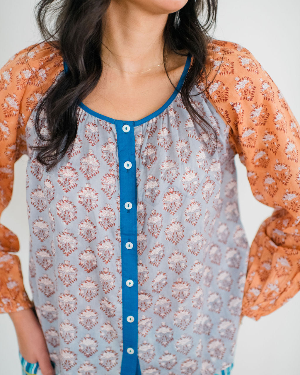 The Ryan Sleep Top by Sundara – a soft cotton pajama top with relaxed fit and hand-block printed details, designed for all-day comfort