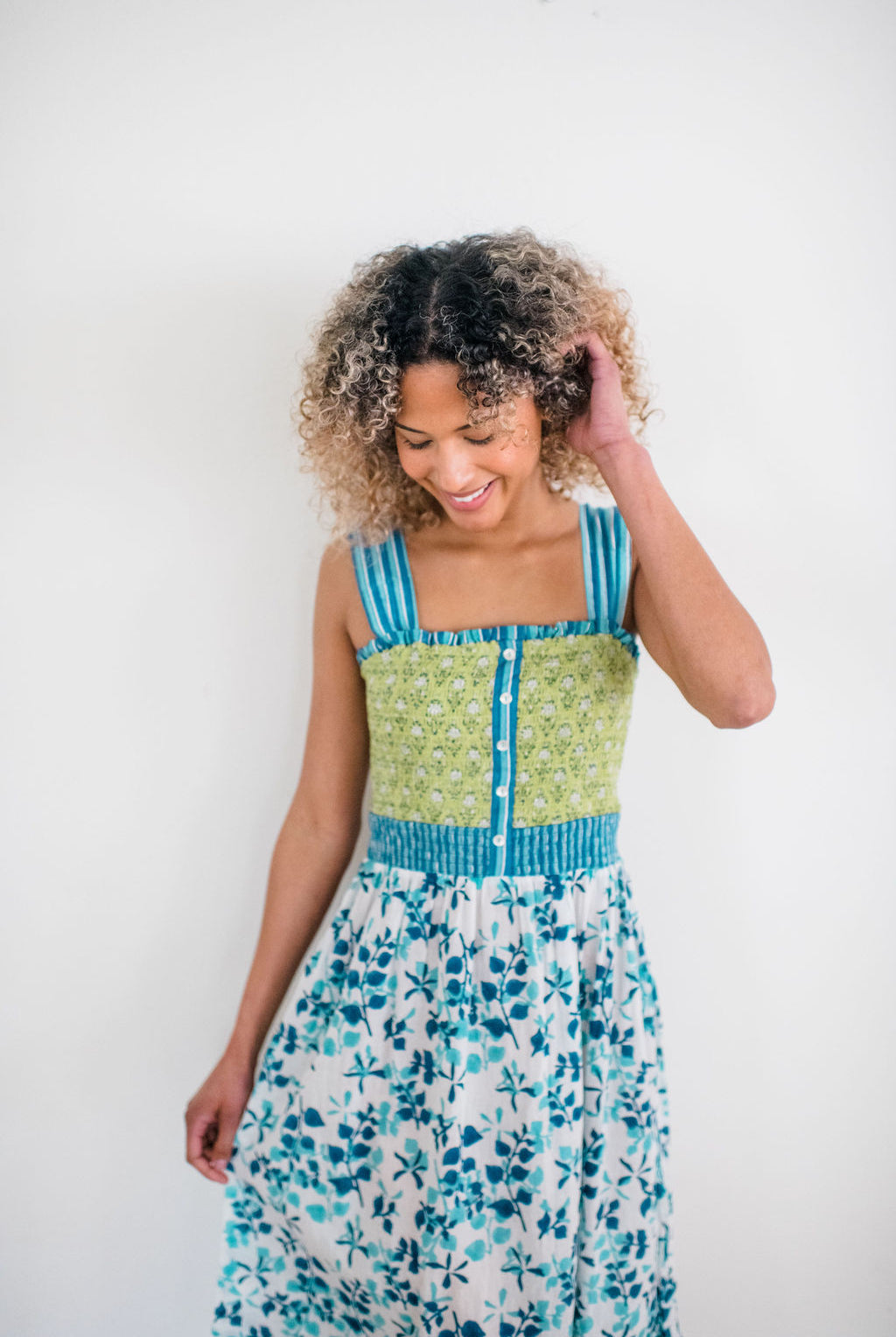 Woman wearing the Stella Nightgown by Sundara – a soft, cotton nightgown with elegant hand-block prints, offering a relaxed and cozy look for peaceful nights.