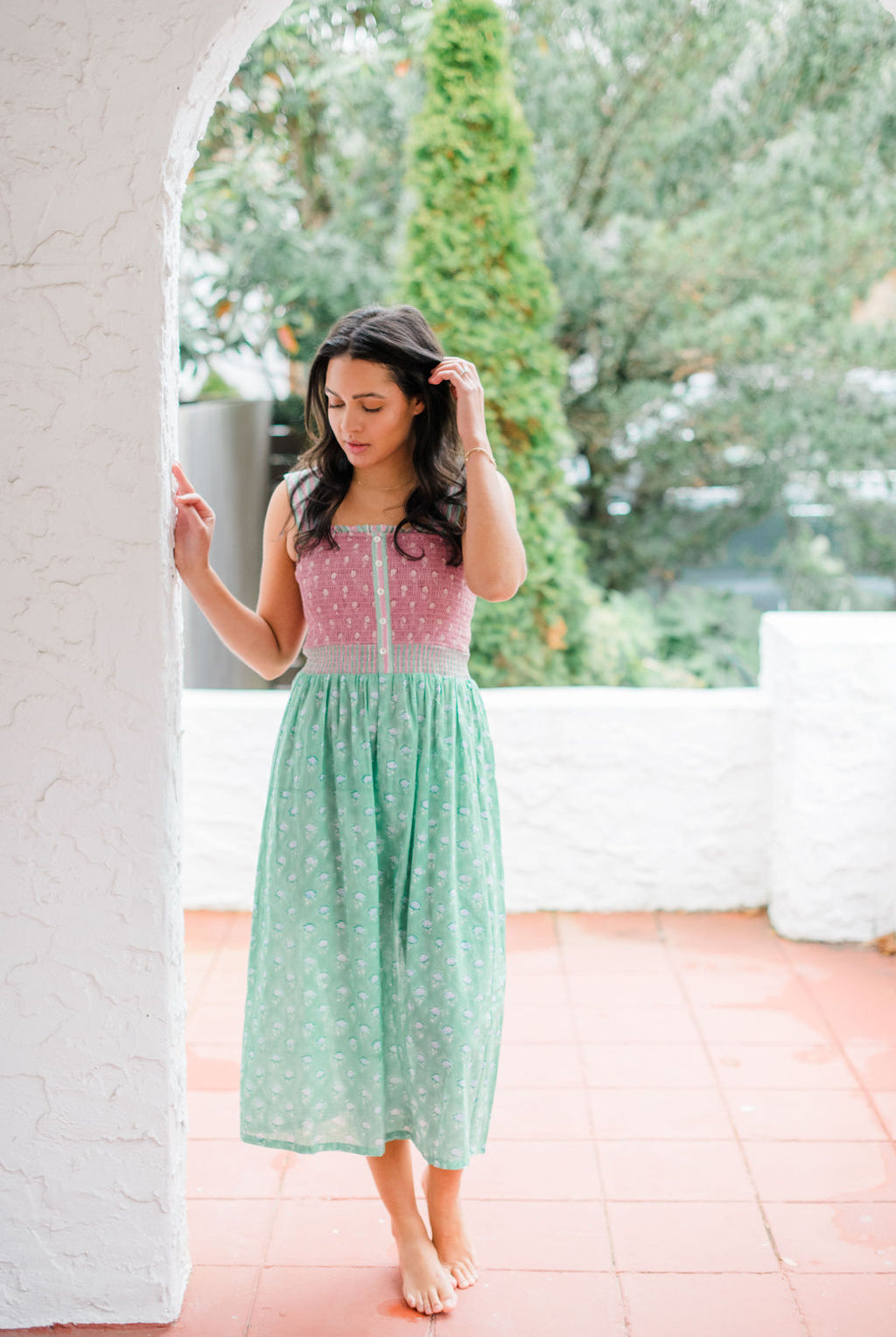 Woman wearing the Stella Nightgown by Sundara – a soft, cotton nightgown with elegant hand-block prints, offering a relaxed and cozy look for peaceful nights.