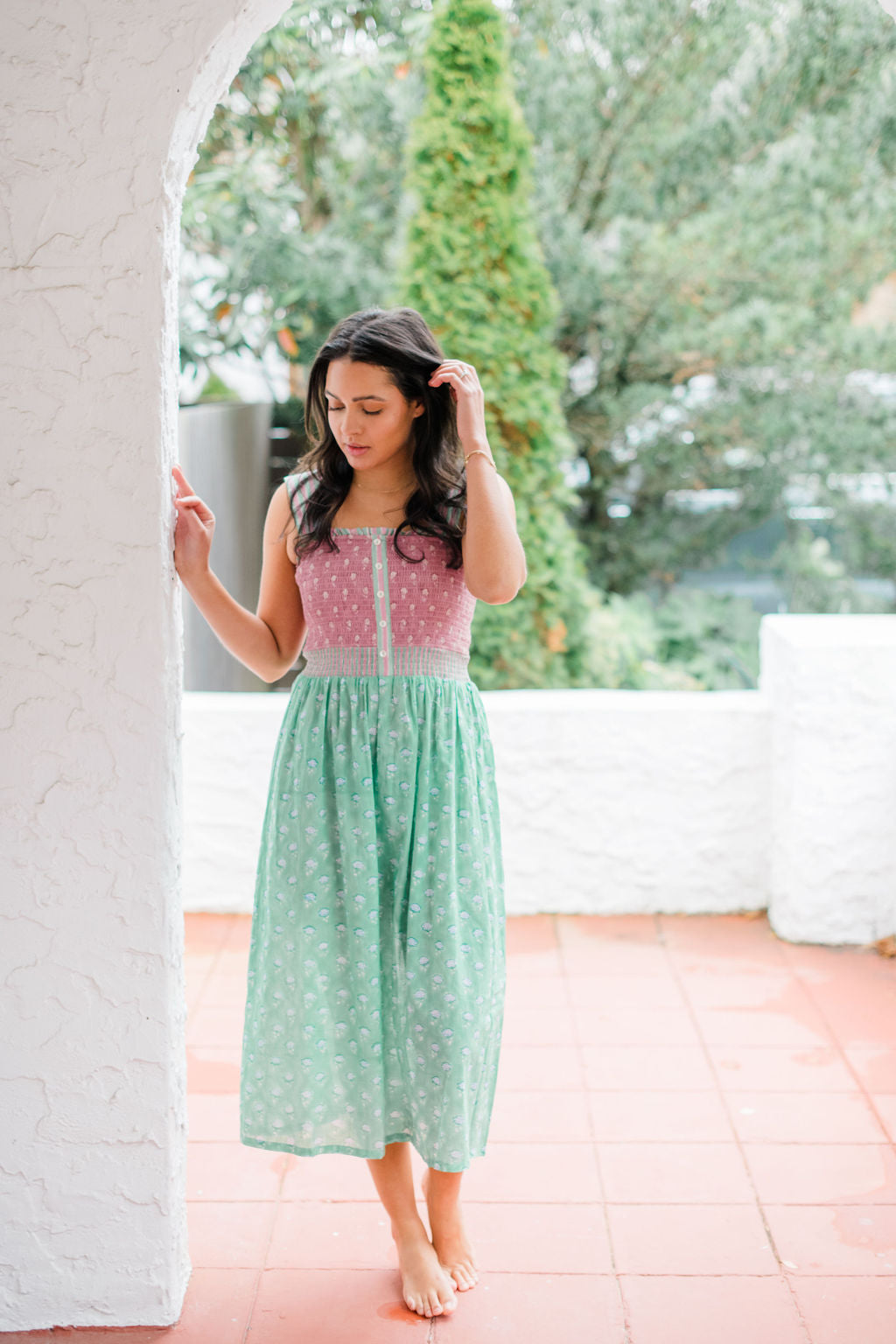Woman wearing the Stella Nightgown by Sundara – a soft, cotton nightgown with elegant hand-block prints, offering a relaxed and cozy look for peaceful nights.