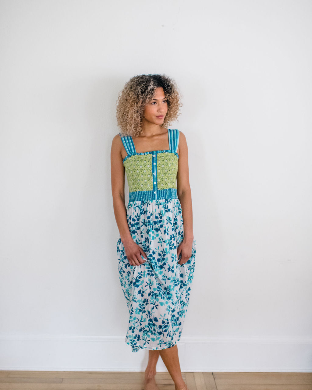 Woman wearing the Stella Nightgown by Sundara – a soft, cotton nightgown with elegant hand-block prints, offering a relaxed and cozy look for peaceful nights.