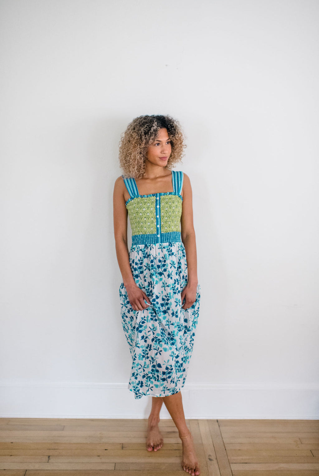 Woman wearing the Stella Nightgown by Sundara – a soft, cotton nightgown with elegant hand-block prints, offering a relaxed and cozy look for peaceful nights.