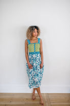 Woman wearing the Stella Nightgown by Sundara – a soft, cotton nightgown with elegant hand-block prints, offering a relaxed and cozy look for peaceful nights.