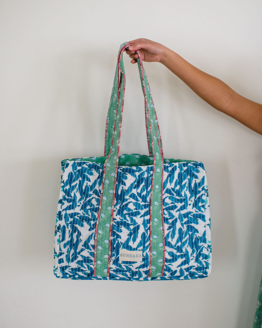 The Sundara quilted tote bag – a spacious, stylish carryall perfect for the beach, market, or everyday use, featuring a luxurious quilted design