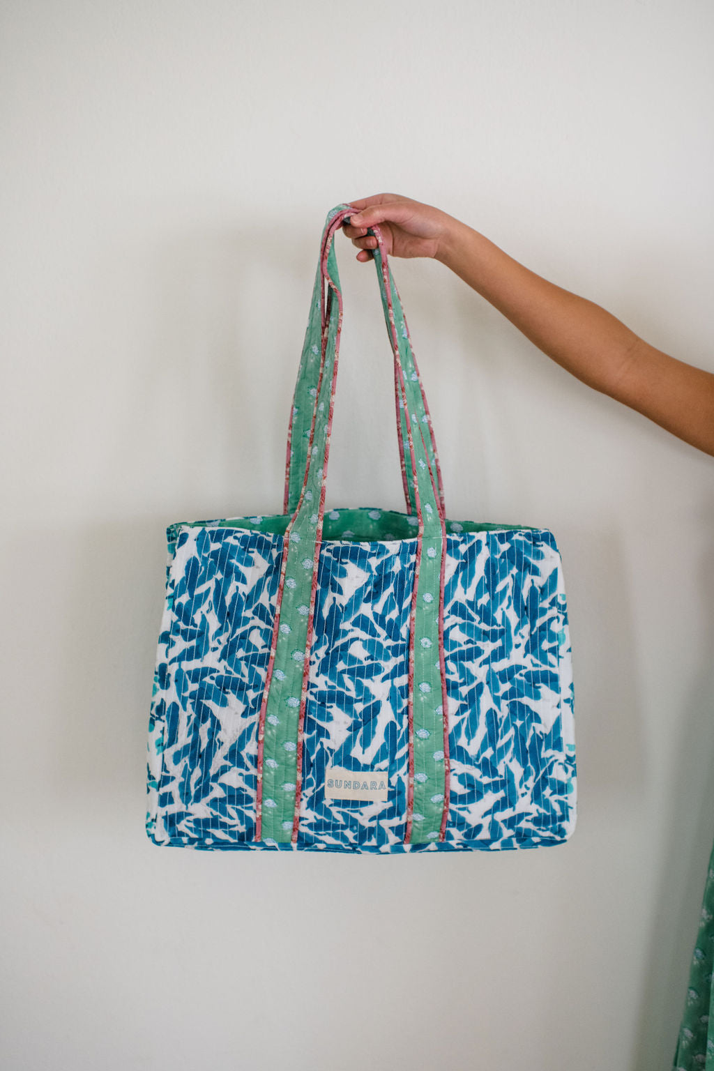 The Sundara quilted tote bag – a spacious, stylish carryall perfect for the beach, market, or everyday use, featuring a luxurious quilted design