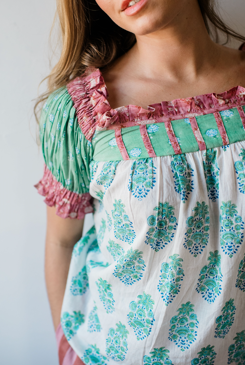 Close-up of the Winnie Top by Sundara – featuring delicate hand-block prints on breathable cotton, highlighting the soft texture and relaxed silhouette.