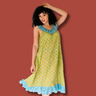  Woman wearing Sundara’s  Dorothy Top – relaxed, block-printed cotton sleepwear designed for comfort and beauty.