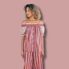 The Winnie Top and Logan Stripe Pant by Sundara – a relaxed cotton pajama set featuring delicate hand-block prints on the top and stylish striped pants for effortless comfort