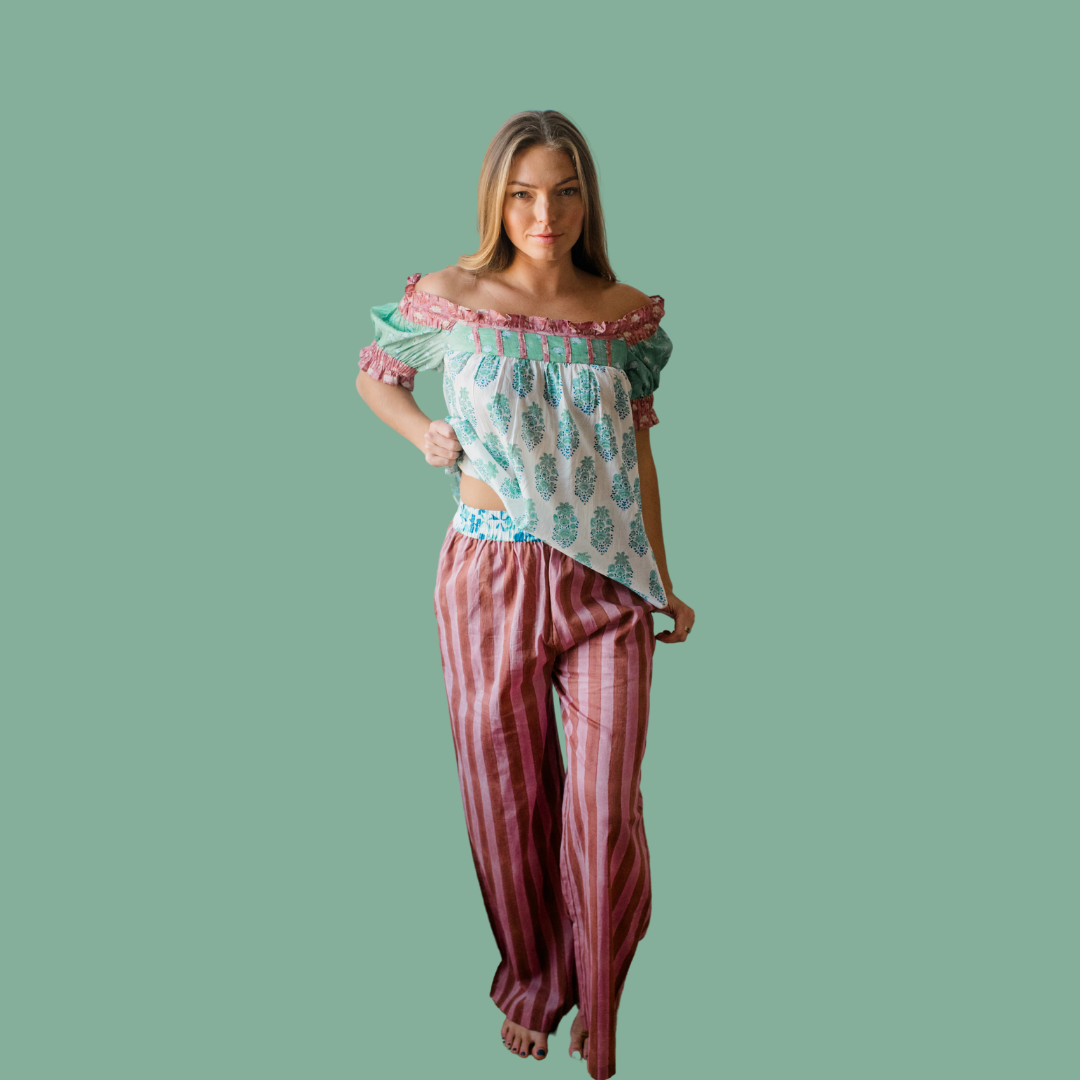 Empowered woman wearing striped Logan Pajama Pant