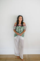 Woman wearing the Winnie Top and Logan Pant by Sundara – a cozy cotton pajama set with hand-block printed details, designed for relaxed, everyday comfort