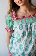 Close-up of the Winnie Top by Sundara – featuring delicate hand-block prints on breathable cotton, highlighting the soft texture and relaxed silhouette.