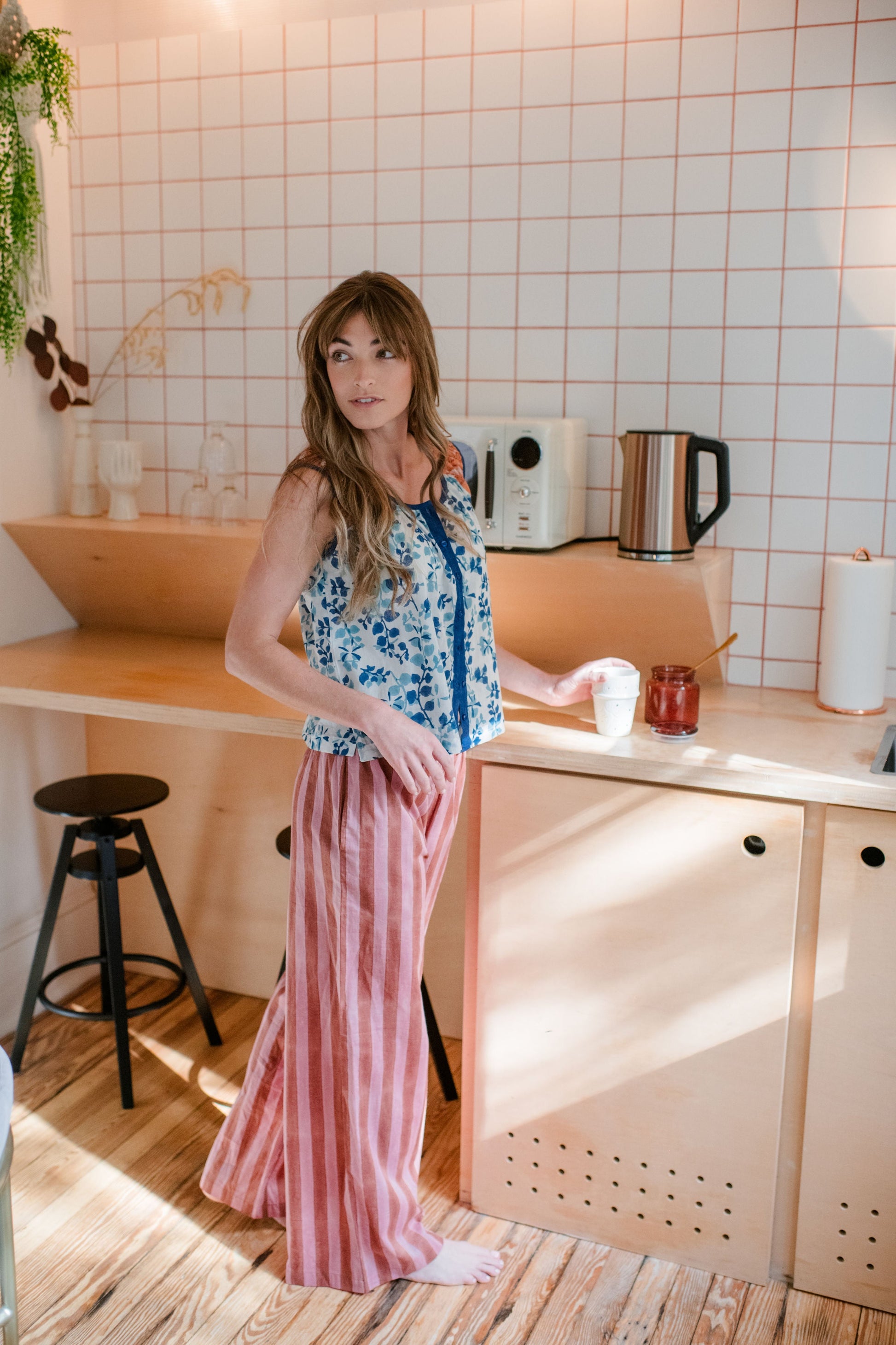 woman standing near counter wearing eco-friendly Logan Pajama Pant